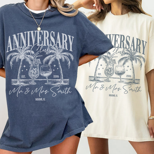 Two people wearing bachelorette t-shirts with 'Anniversary Club' design featuring palm trees and cocktails.