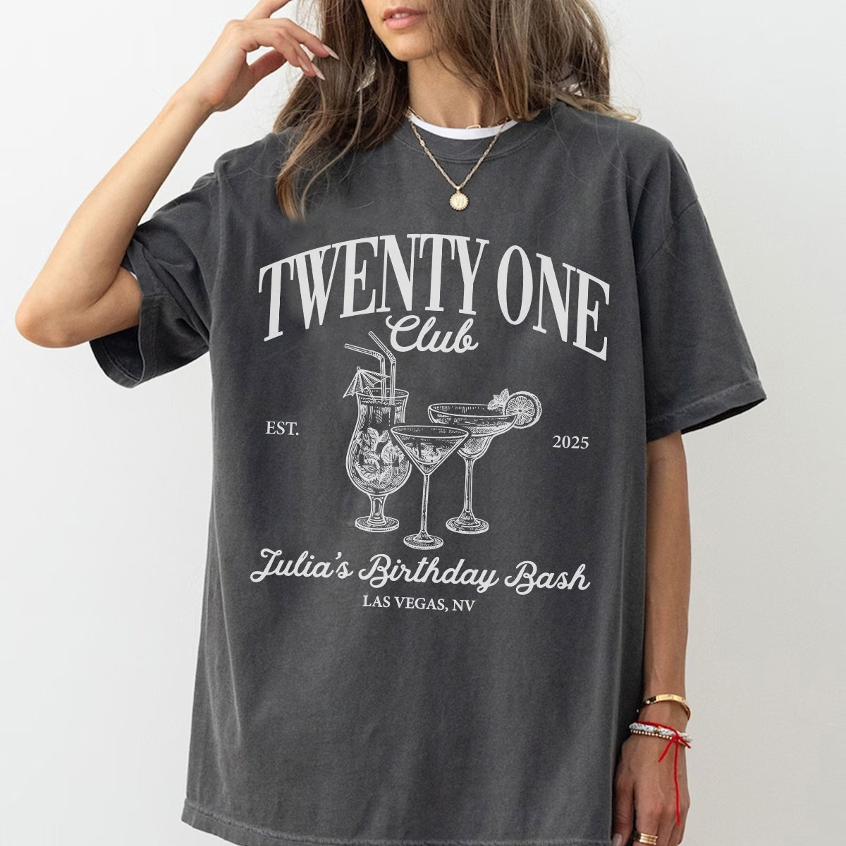Person wearing a dark gray bachelorette t-shirt with 'Twenty One Club' design and text.
