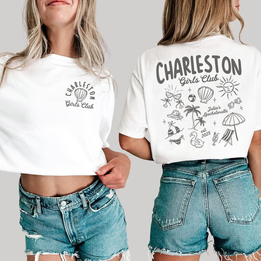 Two people wearing white bachelorette t-shirts with 'Charleston Girls Club' design on a plain background