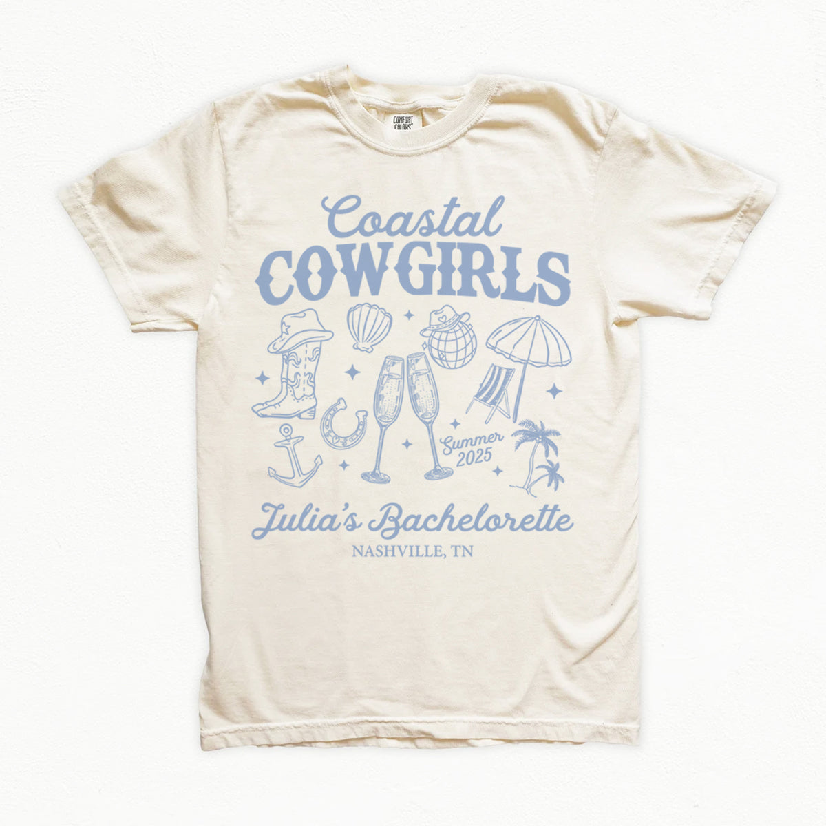 Beige bachelorette t-shirt with blue 'Coastal Cowgirls' design on a white background