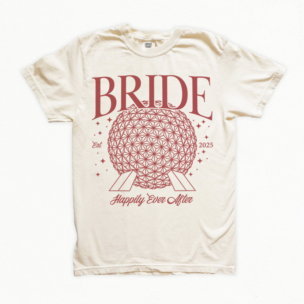 Beige bachelorette t-shirt with red 'BRIDE' design and text on a white background