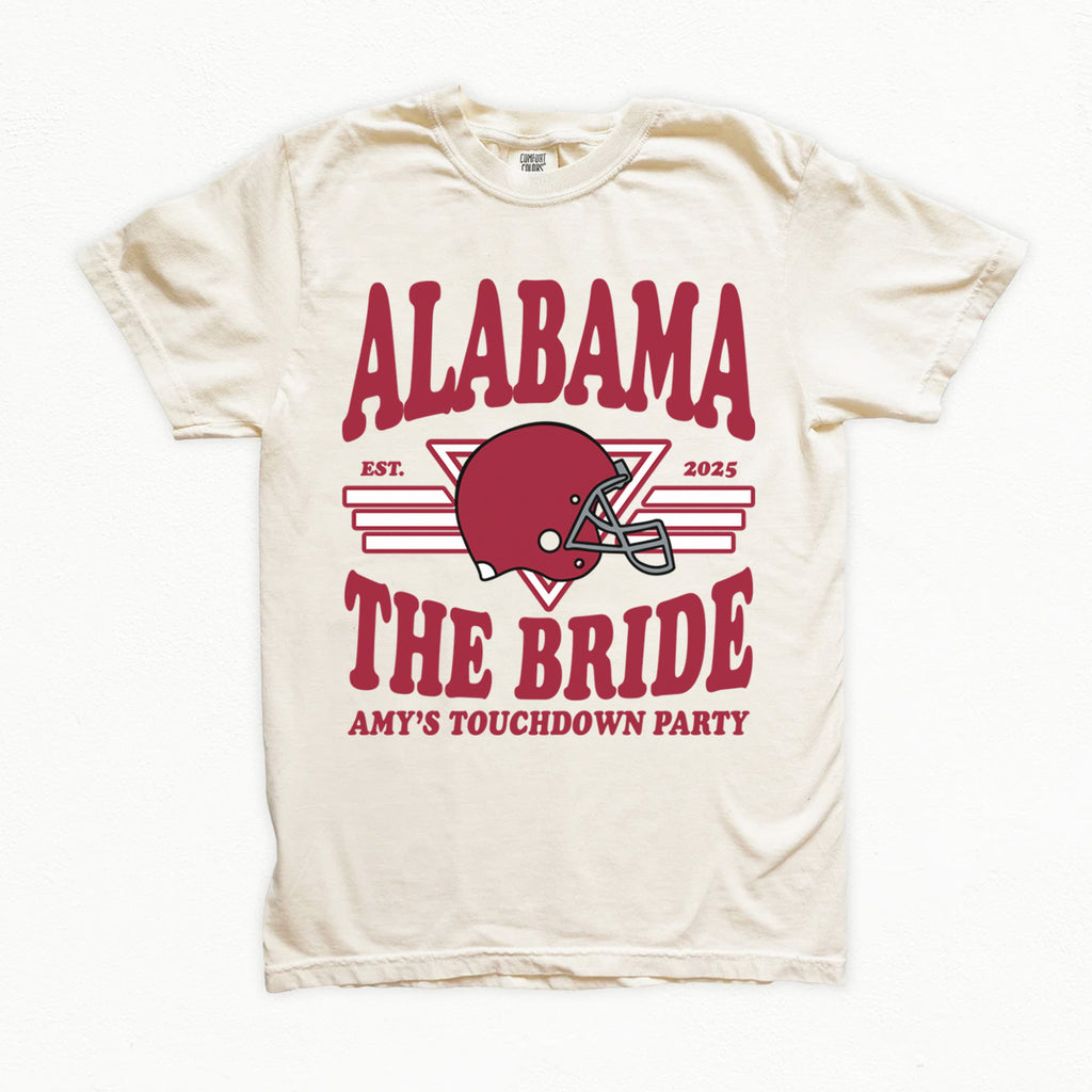 White bachelorette t-shirt with red 'Alabama' text and football helmet graphic on a white background