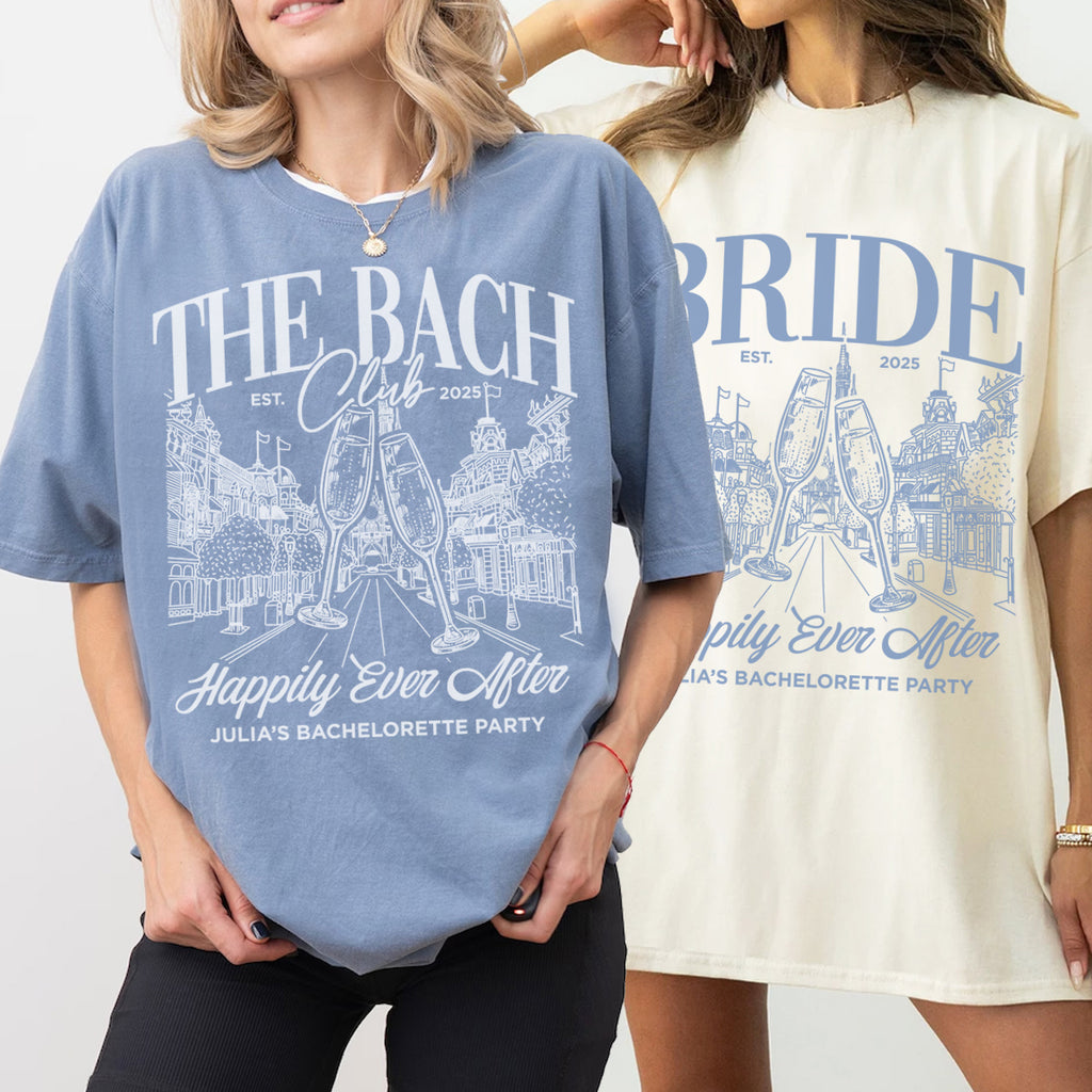Two people wearing bachelorette t-shirts with 'The Bach Club' and 'Bride' designs on a plain background.