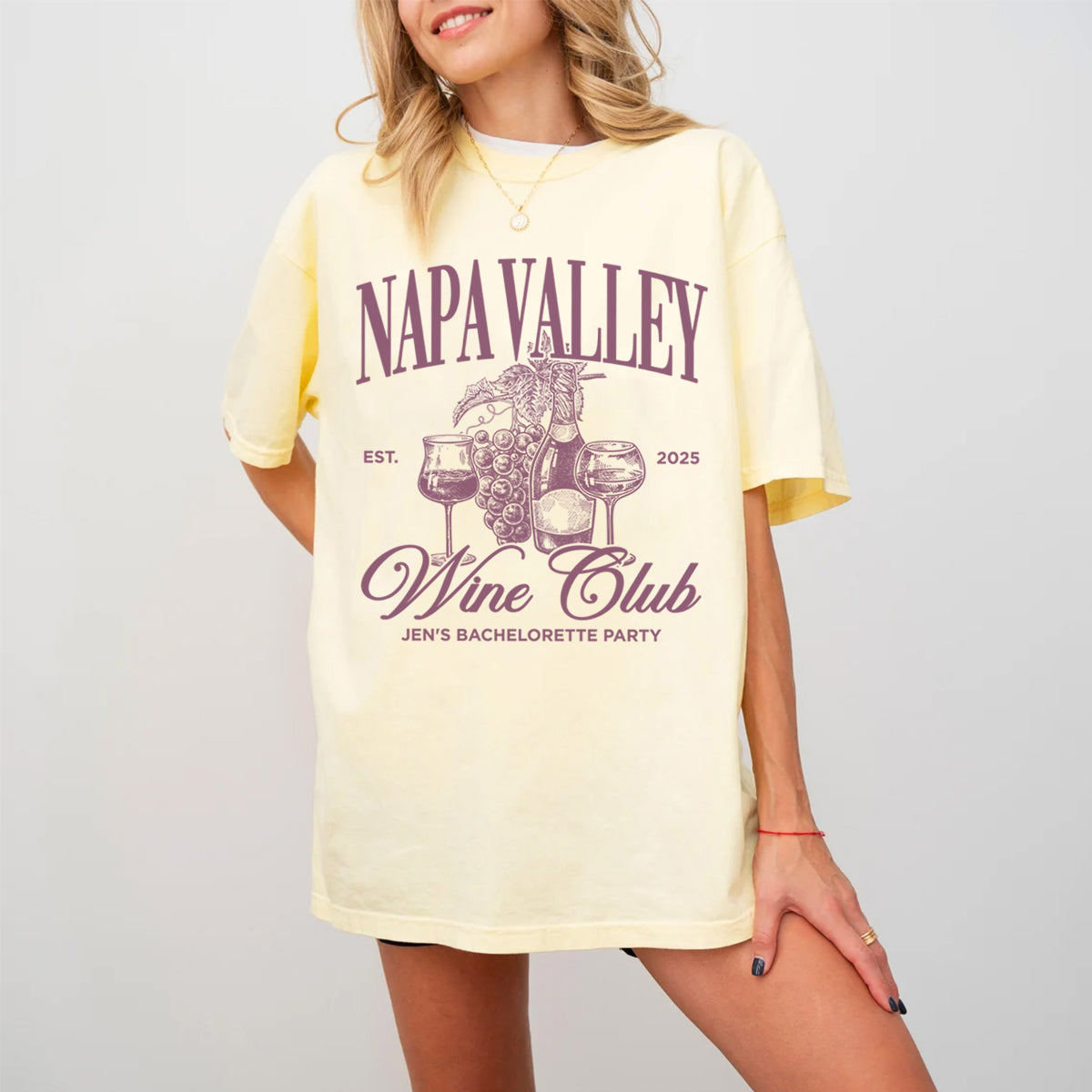 Woman wearing a yellow t-shirt with 'Napa Valley Wine Club' bachelorette 
design on a plain background