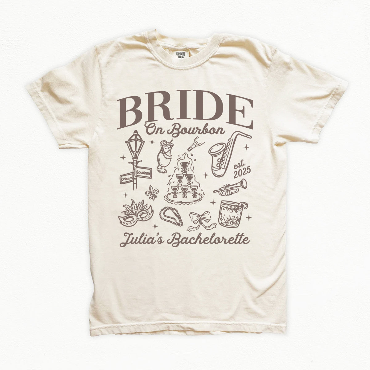 Beige t-shirt with 'Bride on Bourbon' design and text on a white background